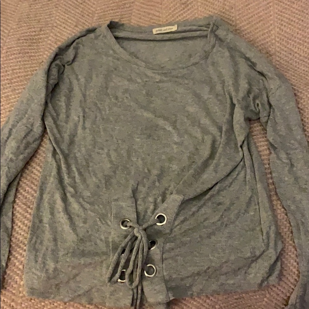 I am selling a grey long sleeve shirt.